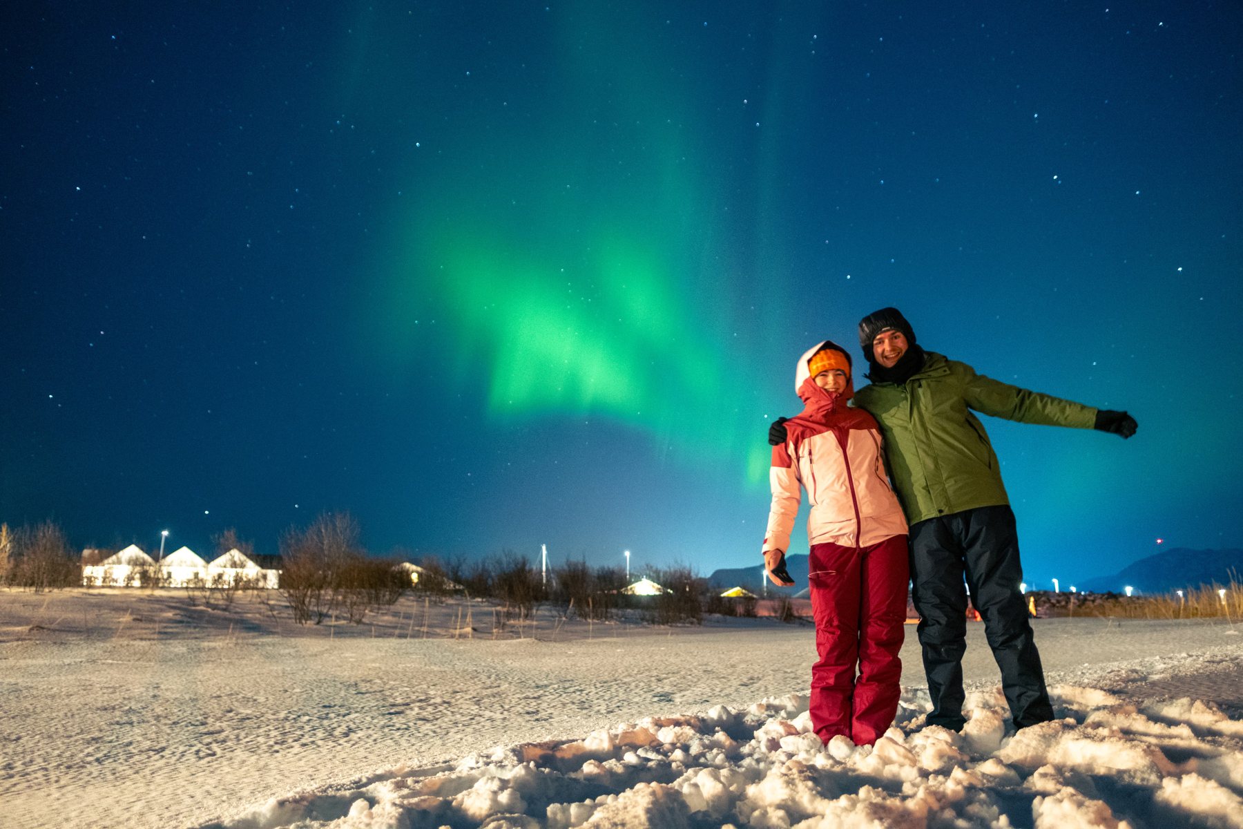 Ellie and Sam beneath the northern lights