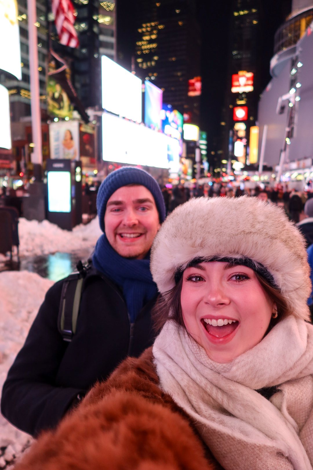 Ellie and Sam among the lights of Times Square